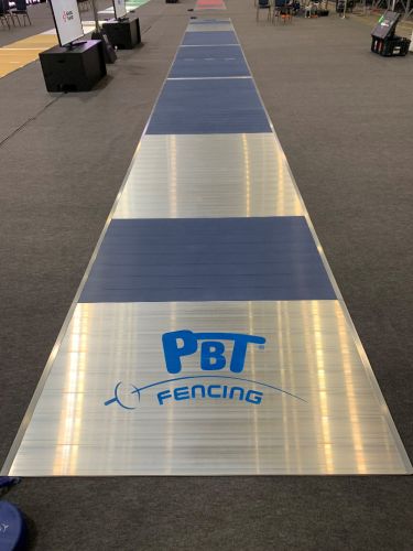 Olympic colored FIE aluminium fencing piste in segments 18 x 1,5 m with two logos
